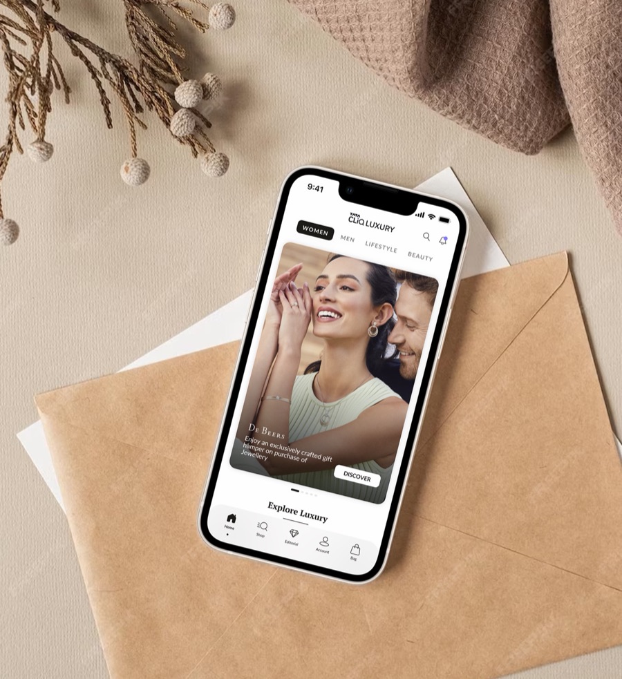 The redesigned Tata CLiQ Luxury app homepage on a phone